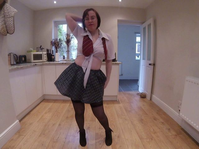 British Wife and Stepmom Haley Wearing Uniform Stockings and Suspenders Dancing Striptease. (Horny vixen)