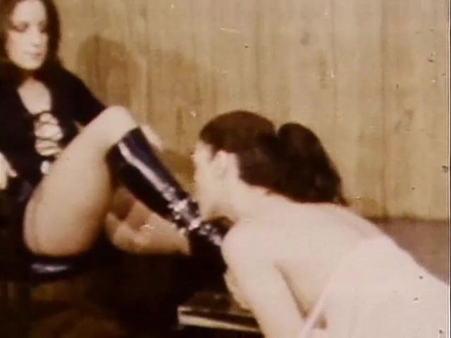 Lesbian Mistress in Leather Dress and Black Boots Dominating a Tender Slave in American Vintage Lezdom Porn Video (Vintage megastore)