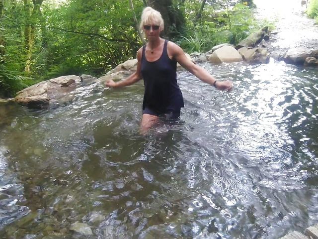 Alexa Cosmic Trans Girl Swimming in Font Near Waterfall Wearing Shorts and T-shirt... (Alexa Cosmic)